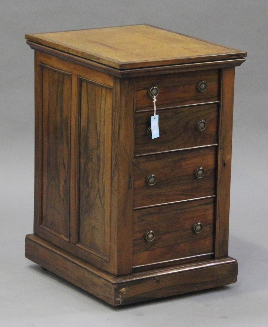 A Regency rosewood Wellington/Davenport desk, the rotating leather writing surface revealing pop-