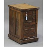 A Regency rosewood Wellington/Davenport desk, the rotating leather writing surface revealing pop-