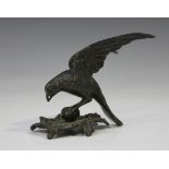 A 19th century brown patinated cast bronze model of a bird perched on an acanthus leaf mount, height