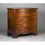 A George III mahogany serpentine fronted chest with rosewood crossbanded decoration, fitted with two