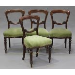 A set of four Victorian mahogany balloon back dining chairs, upholstered in green velour, raised