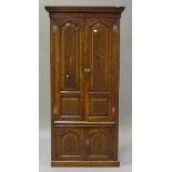 An 18th century oak corner cabinet with inlaid star motifs and crossbanded decoration, the moulded