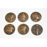 Emile Monier - a set of six early 20th century French brown patinated cast bronze medallions, each