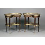 A pair of early 20th century French mahogany kidney shaped tables with rouge marble tops, the