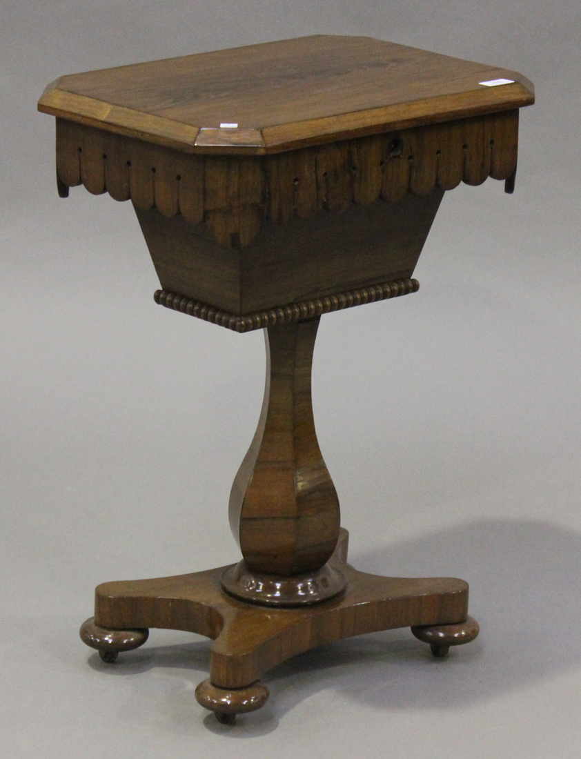 A William IV rosewood work table, the canted rectangular top above a shaped frieze, raised on a
