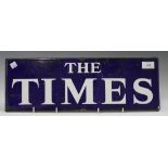 An enamel advertising sign for 'The Times', 16cm x 47cm. Provenance: from the estate of the late