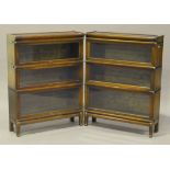 A pair of early 20th century Globe Wernicke oak three-section glazed bookcases on cabriole legs,