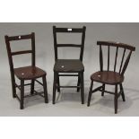 A group of three early 20th century stained beech and elm stick and bar back children's chairs.