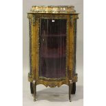 A late 19th century Louis XV style kingwood vitrine with overall applied gilt metal mounts, the