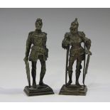 A pair of late 19th century cast bronze diminutive figures of standing knights, raised on stepped