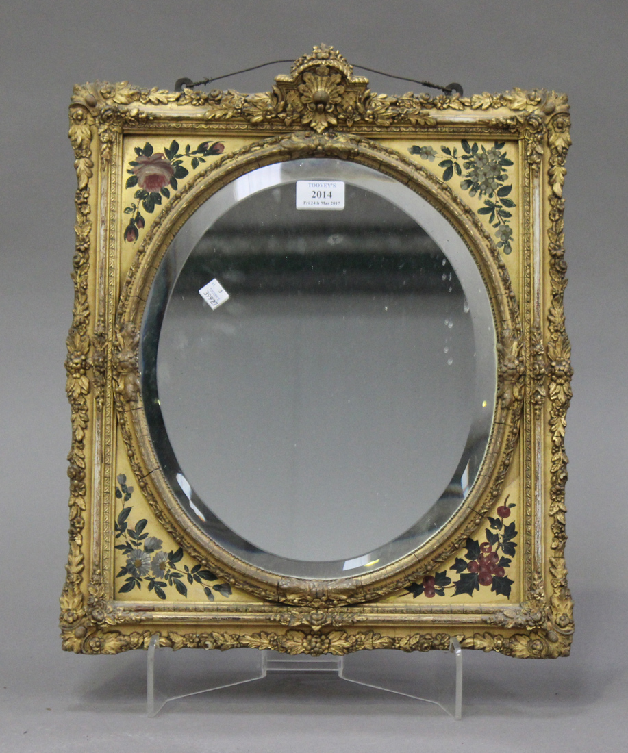 An Edwardian carved giltwood mirror, the rectangular foliate moulded frame with painted decoration