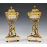 A pair of late 19th century gilt bronze and white marble cassolettes of classical brazier form,