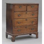 An 18th century oak chest of two short and three long drawers, on bracket feet, height 115cm,