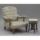 A Victorian gentleman's armchair, the buttoned back and upholstered seat raised on turned oak legs