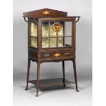 An Edwardian Arts and Crafts Glasgow School mahogany display cabinet, in the manner of E.A.