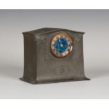 A Liberty & Co 'English Pewter' mantel timepiece, model number 01087, the circular blue enamelled