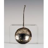 An Arts and Crafts style silver caddy spoon, the circular bowl with hammered decoration, the