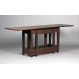 A mid-20th century Arts and Crafts style teak side table by Warren Hill Studio, the long rectangular