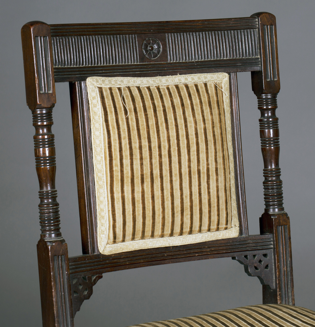 A late Victorian mahogany side chair, in the manner of E.W. Godwin, the reeded bar back with ring - Image 2 of 2