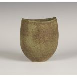 A John Ward studio pottery stoneware vessel of oval outline, covered in a mottled green and grey