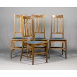 A set of four Edwardian Arts and Crafts Glasgow School oak dining chairs, possibly designed by E.