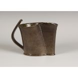 A Walter Keeler studio pottery salt glazed jug of irregular form, covered in a dark brown salt