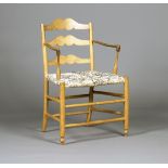 An Edwardian Arts and Crafts ash ladder back 'Pass' chair, after a design by Ernest Gimson and