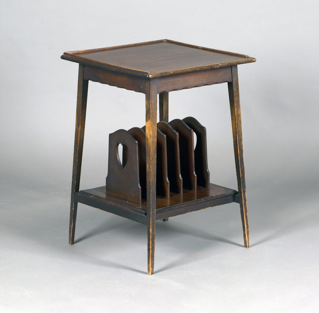 An early 20th century Arts and Crafts style mahogany two-tier occasional table, the galleried top