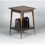 An early 20th century Arts and Crafts style mahogany two-tier occasional table, the galleried top