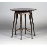 A late Victorian Arts and Crafts mahogany shaped circular occasional table, in the manner of