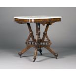 A late Victorian Aesthetic period walnut marble-topped centre table, in the manner of Charles