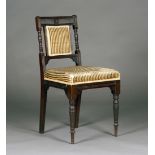 A late Victorian mahogany side chair, in the manner of E.W. Godwin, the reeded bar back with ring