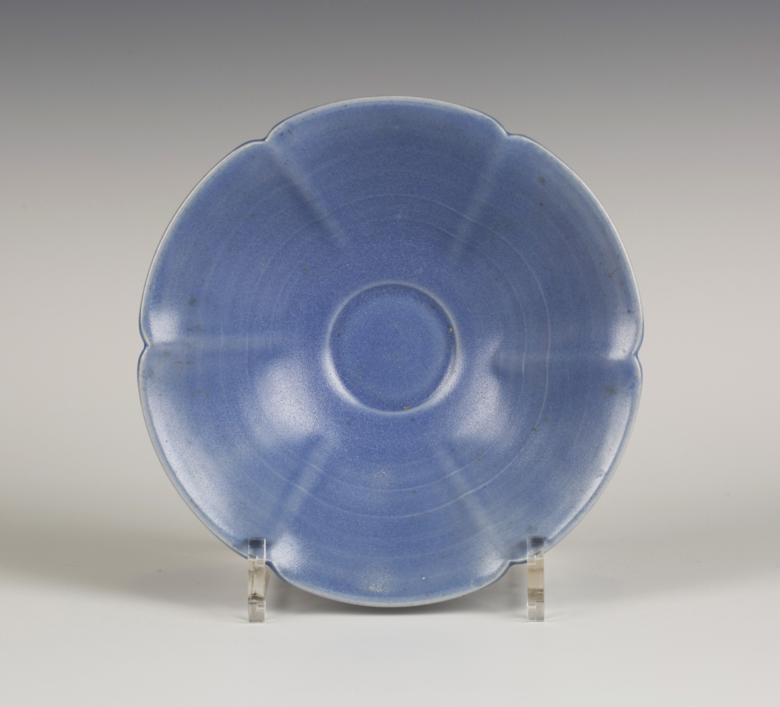 A Charles Vyse stoneware footed dish of shaped outline, covered in a lavender blue glaze, incised '