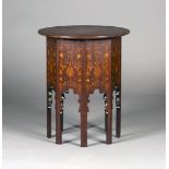 An Edwardian Art Nouveau mahogany circular occasional table by S.J. Waring & Sons, with overall