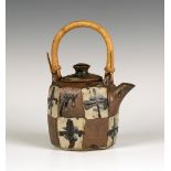 A John Maltby studio pottery teapot and cover, painted with resist panels and a repeating abstract