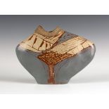 A Carolyn Genders studio pottery white earthenware vessel of flattened irregular form with coiled