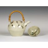 A William 'Bill' Marshall St Ives studio pottery teapot, decorated with blue petals on a cream