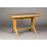 A mid-20th century German cherry wood metamorphic fold-out table, designed by Wilhelm Renz, the