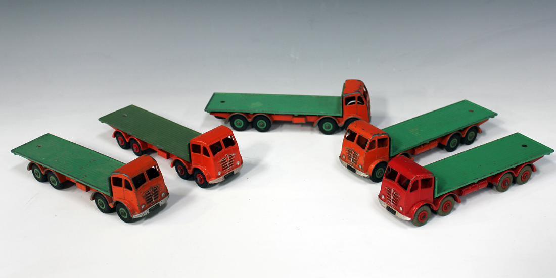 Five Dinky Supertoys No. 902 Foden flat trucks, second type, four with orange cab and chassis with