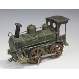 An early 20th century German gauge 1 tinplate clockwork 0-4-0 locomotive, finished in green and