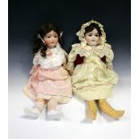 A Schoenau & Hoffmeister bisque head doll, impressed 'PB' within a star and '1909 7½', with a