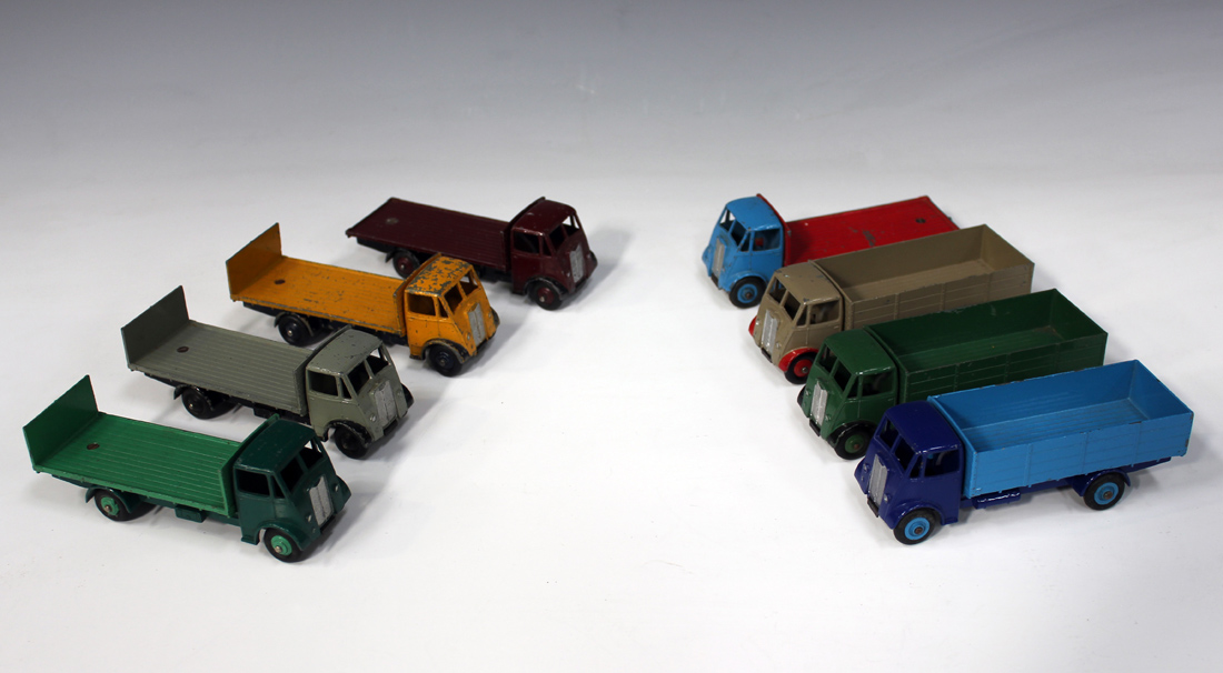 Three Dinky Supertoys No. 511 Guy 4 ton lorries, first type cabs, two No. 512 Guy flat trucks, first