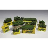 Ten Dinky Toys and Supertoys army vehicles, comprising a No. 660 tank transporter, a No. 651