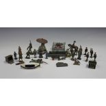 A collection of lead figures, including Second World War soldiers and five dwarfs from Snow White