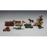 A small collection of Dinky Toys vehicles and implements, including a No. 300 Massey-Harris tractor,