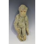 A 1920s mohair monkey with amber and black eyes and felt face, ears, hands and feet, height 25cm.