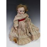 A German bisque head doll, possibly Armand Marseille, impressed 'DEP 7', with later wig, closing