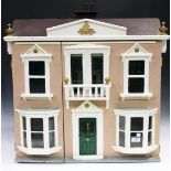 A painted wooden doll's house, early 20th century, the double hinged front revealing three rooms,