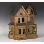 A Gottschalk blue roofed and lithographed wooden doll's house, late 19th century, the base with