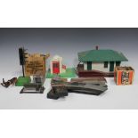 A collection of Lionel gauge O items, including five locomotives, a tender, coaches, a station and